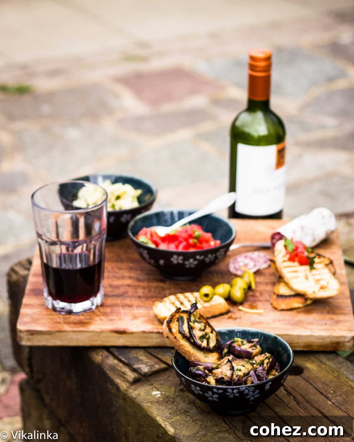 Italian Antipasti Spread with varied toppings including tomatoes and eggplant