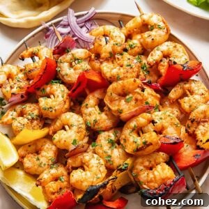 Shrimp kebabs skewers stacked on top of each other on a plate