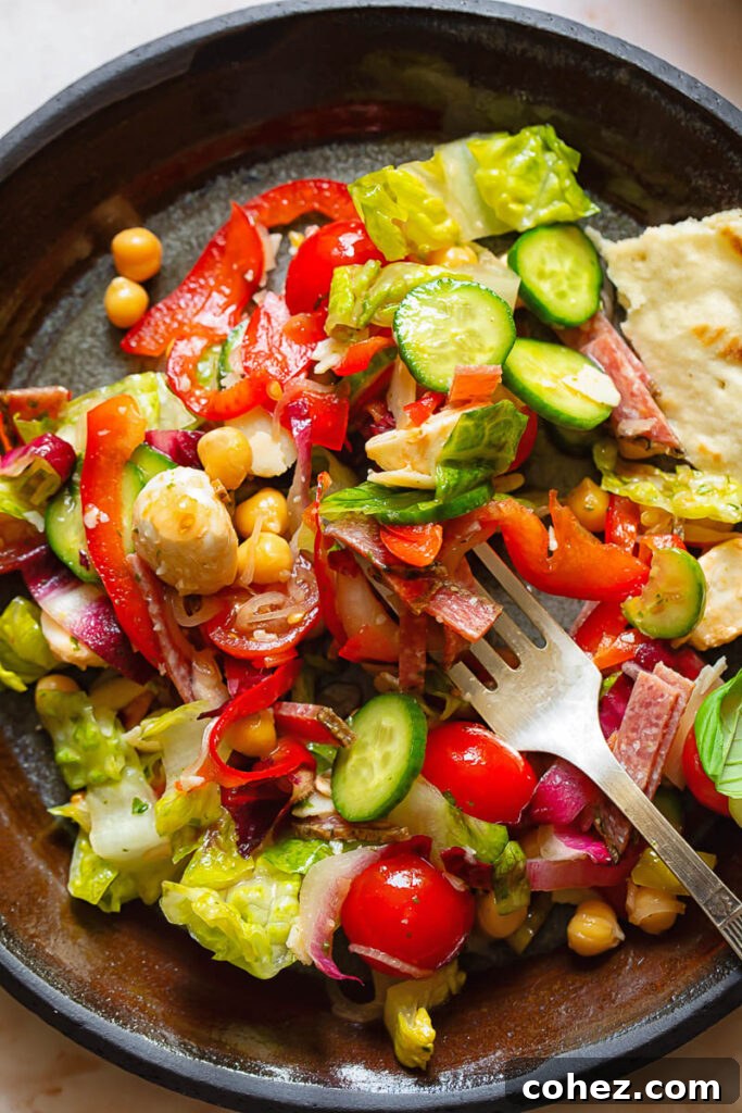Close up shot of Italian chopped salad on a plate with bread