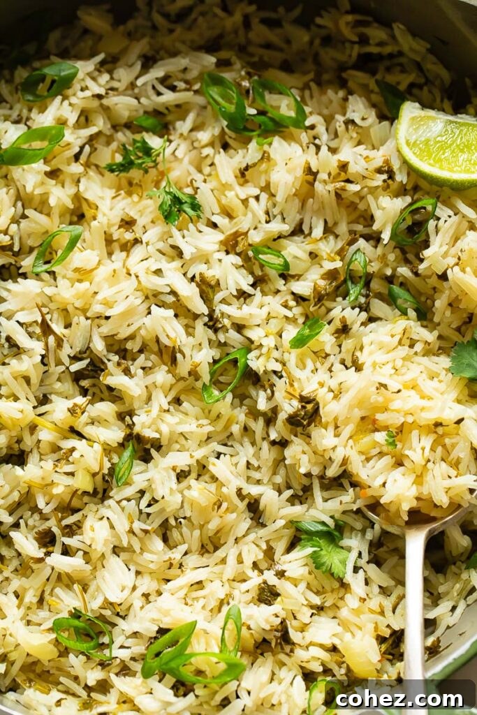 Zesty Cilantro Lime Rice 3 Close up of cilantro lime rice with a serving spoon