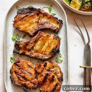 Flame Kissed Teriyaki Pork Chops 6 Top down shot of grilled teriyaki pork chops on a serving platter