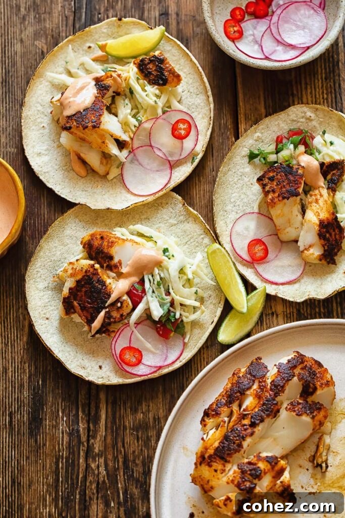 Cajun Fish Tacos 3 A table spread with several beautifully assembled fish tacos, ready to be enjoyed