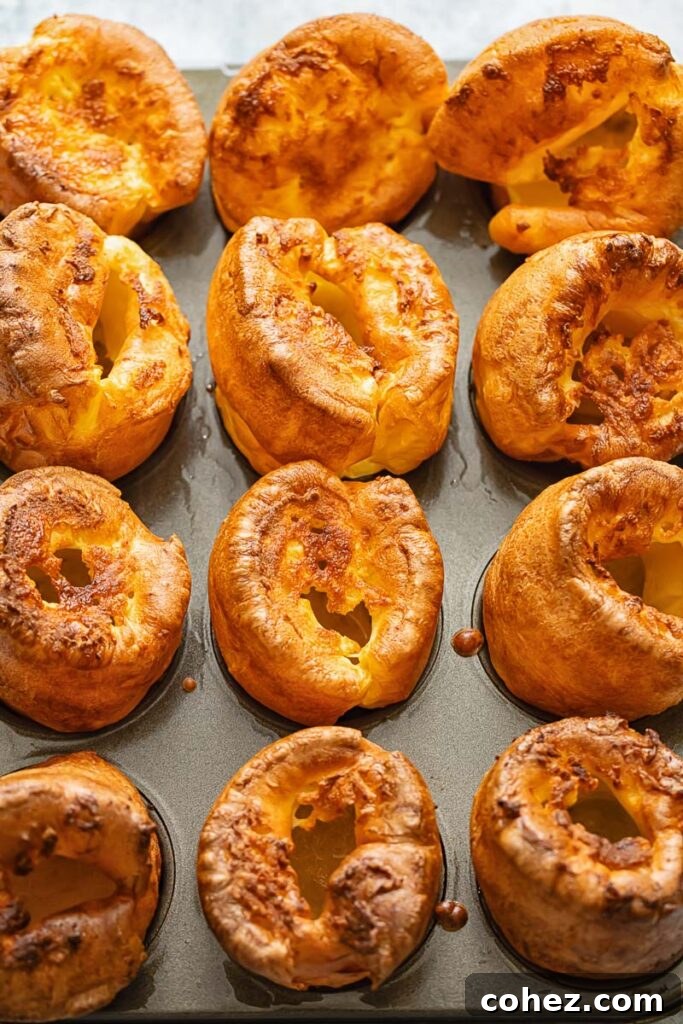 Yorkshire's Golden Puff 4 Yorkshire puddings lined up on a baking sheet