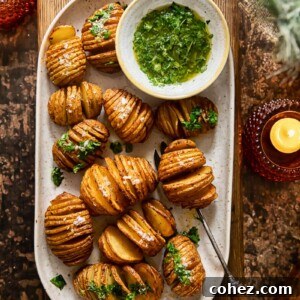 Top-down view of a platter with elegant Hasselback potatoes arranged on a wooden serving board, ready for a festive dinner.