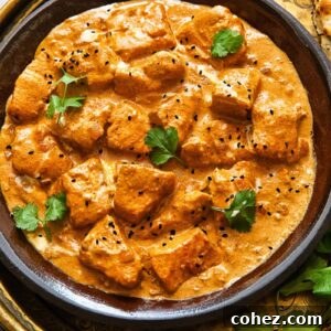 Top down shot of butter salmon curry on a plate