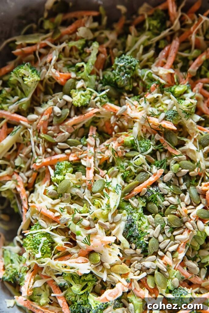 Close up of broccoli slaw salad with dill dressing