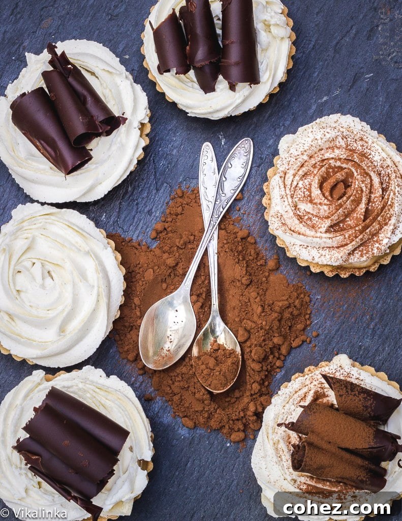 Top-down view of several banoffee tarts arranged in a circle, garnished with chocolate and spoons in the center, ready to be served.