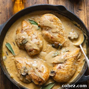 Top down shot of somerset chicken in a pan with creamy cheese sauce