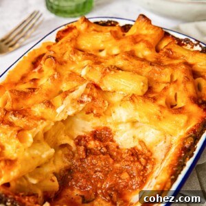 Baked Mac and Cheese with a rich bolognese sauce as the bottom layer, creating a hearty and layered dish.