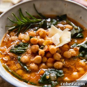 Bowl of Tuscan chickpea soup with rosemary and hard cheese