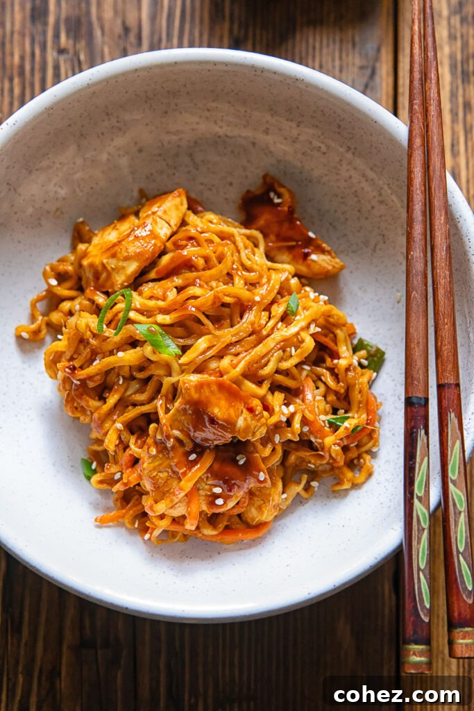 Top down of stir fry peanut chilli noodles in a bowl