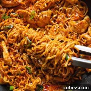 Close up shot of peanut chilli noodles in a pan
