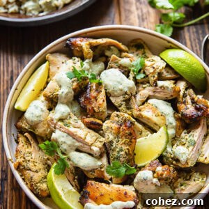 Top down shot of cilantro lime chicken in a bowl with creamy sauce