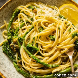 Bowl with the pasta and a slice of lemon with a fork