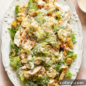 Top down shot of chicken Caesar pasta salad on a serving platter