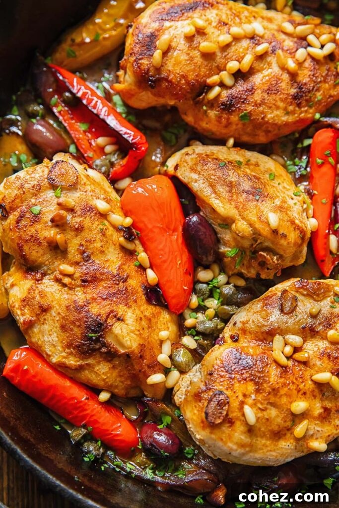 Close up of baked chicken in Mediterranean sauce