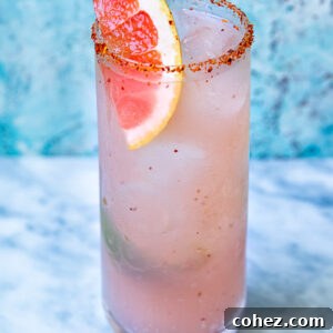 Close up shot of mezcal paloma in a tall glass