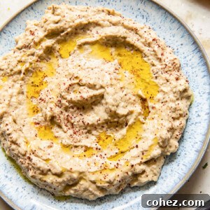 top down view of baba ganoush spread on blue plate