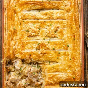 Top down shot of chicken and leak pie in a rectangular baking dish