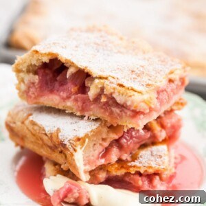 close up of Rhubarb slab pie pieces stacked on a plate