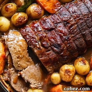 Close up of pot roast and veg in a large pot